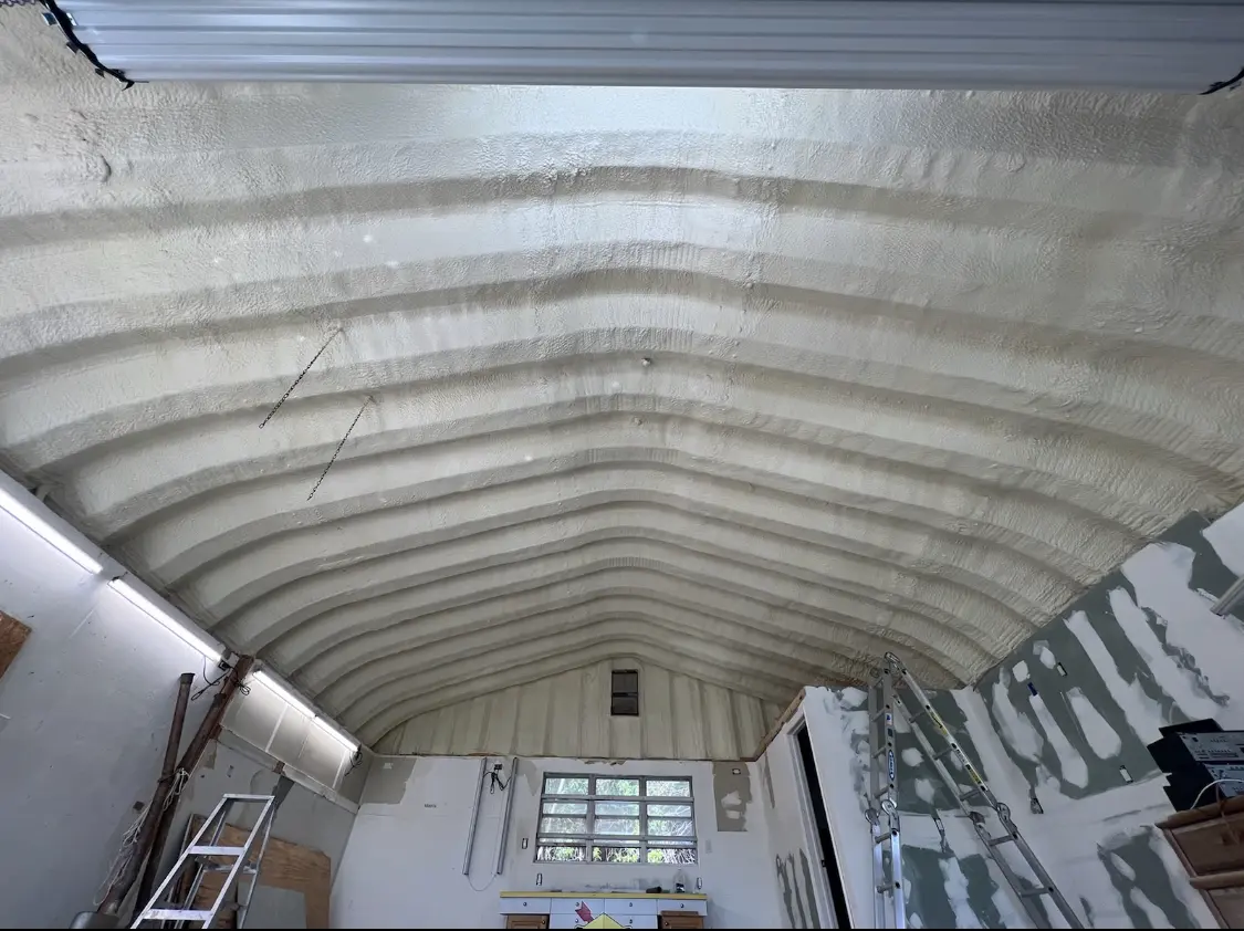 Spray polyurethane foam applied to the underside of a metal roof deck in Florham Park